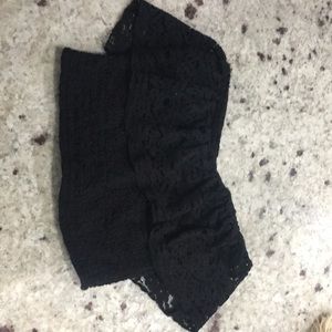 A black strapless stretchy crop top from hollister